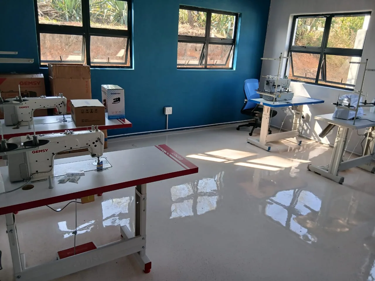The garment room at the ANBI centre, lined with industrial sewing machines