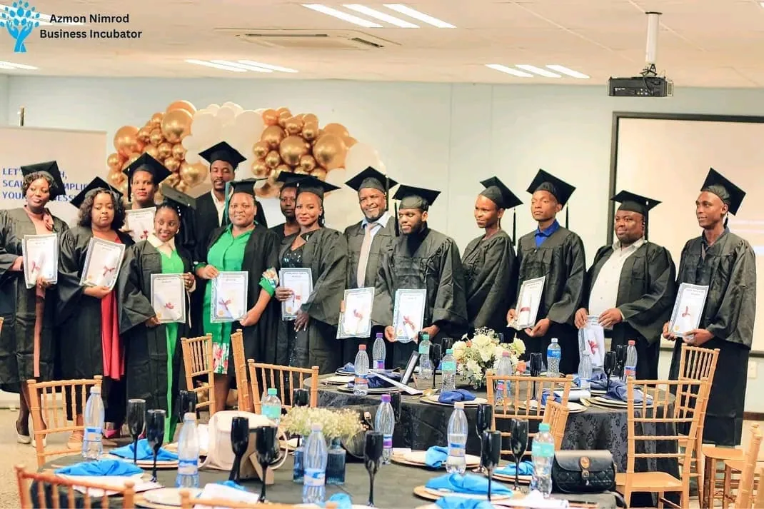 ANBI graduates with their certificates at the graduation ceremony
