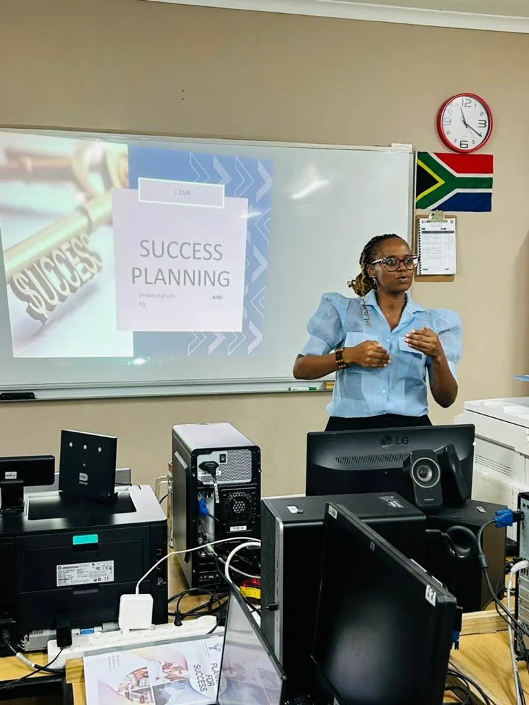 A facilitator presenting a session on success planning to incubatees