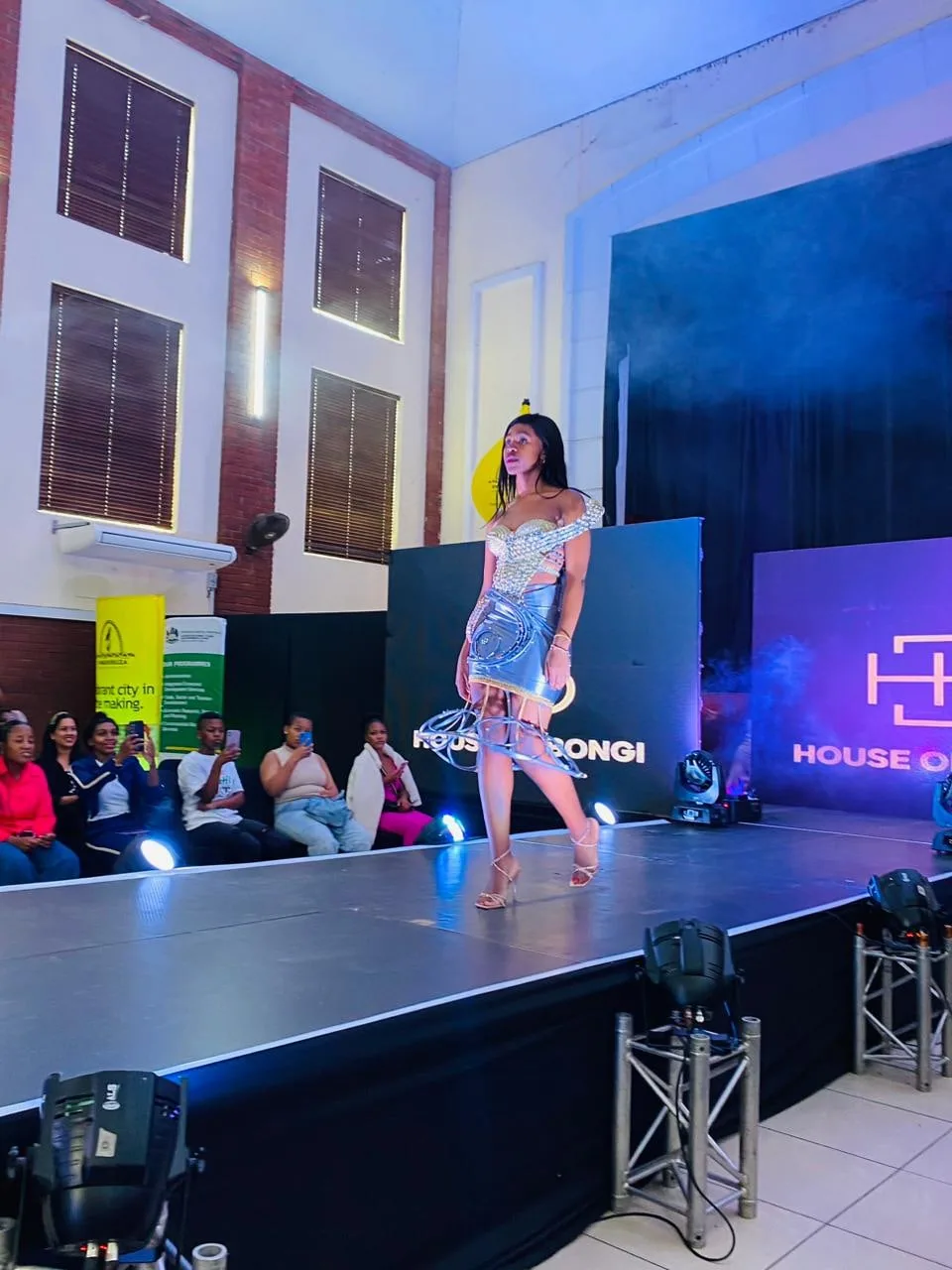 A model in a colourful outfit on the House of Bongi runway